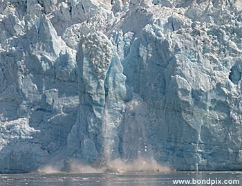 Calving ice falls from the Hubbard Glacier in Yakutat bay, Alaska