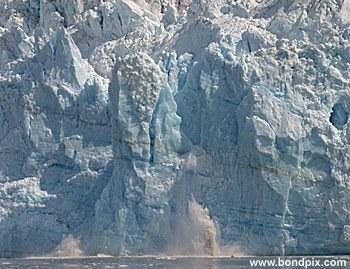 Calving ice falls from the Hubbard Glacier in Yakutat bay, Alaska