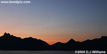 Sunrise over sea and mountains