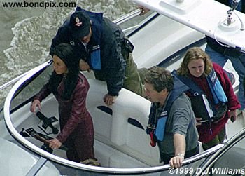 Sarah Donohue, Simon Crane and Vic Armstrong filming the boat chase on the River Thames in London