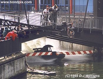 On location with the action unit for the James Bond 007 film 'The World is not Enough'. An exciting boat chase filmed on the River Thames in London