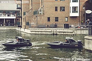 On location with the action unit for the James Bond 007 film 'The World is not Enough'. An exciting boat chase filmed on the River Thames in London