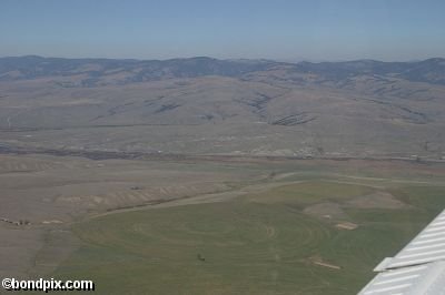 Aerial views over the Deer Lodge valley, Deer Lodge, Anaconda and Butte in Montana