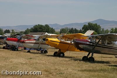 Various aircraft on parade at the annual fly in at Pogreba Field, Three Forks, Montana